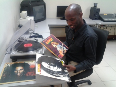 Mr Kwasi Tinglin with LPs of Bob Marley