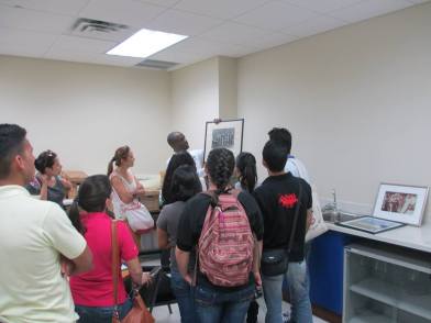Dr Griffin conducts a tour of a visiting group of students from another university