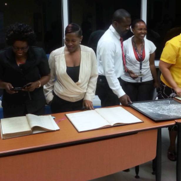 Some students with a cross-section of archival records...